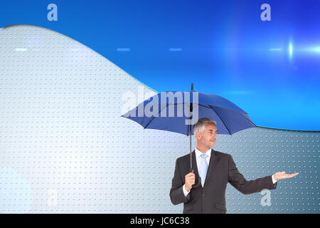 Composite image of businesswoman holding umbrella Banque D'Images