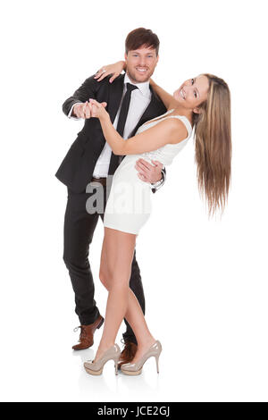 Young couple dancing. Isolated on white Banque D'Images