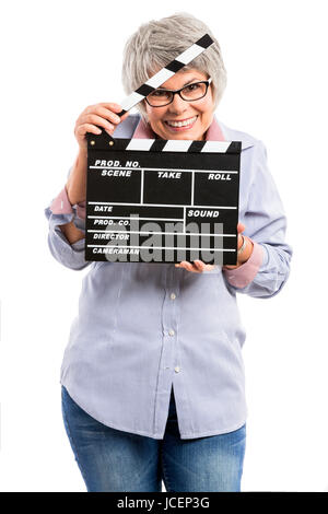 Happy elderly woman holding a deck, isolé sur fond blanc Banque D'Images