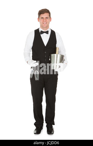 Waiter Holding un vin avec une bouteille de Champagne et le verre à champagne Banque D'Images