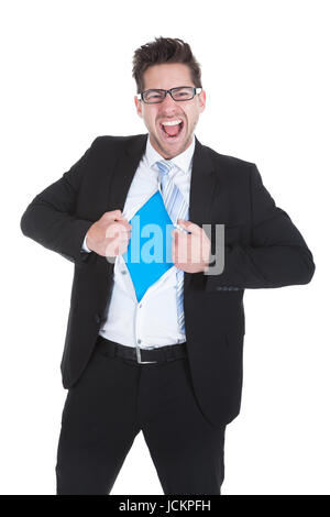 Young businessman déchirer son costume sur fond blanc Banque D'Images