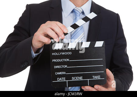 Portrait of Mid adult businessman holding deck over white background Banque D'Images