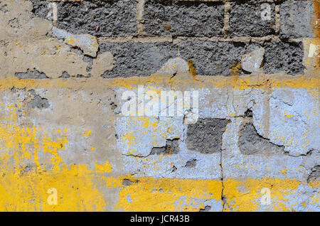La texture du mur de brique gris avec plâtre cassé Banque D'Images