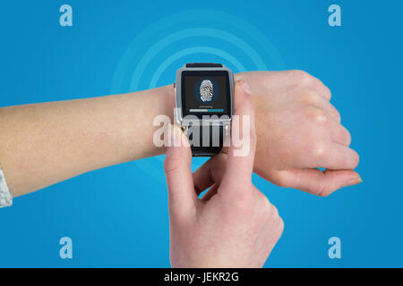 Composite image of woman using smartwatch Banque D'Images