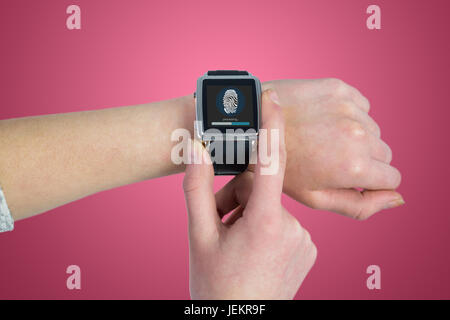 Composite image of woman using smartwatch Banque D'Images