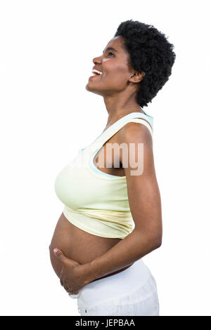 Pregnant woman touching her belly Banque D'Images