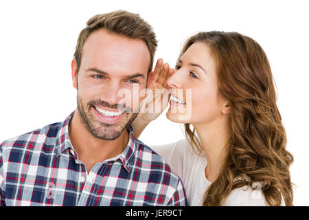 Woman whispering dans mans oreilles Banque D'Images