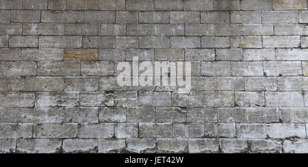 Mur de calcaire gris et blanc travertin et blocs de brique, Close up texture de fond, side view Banque D'Images