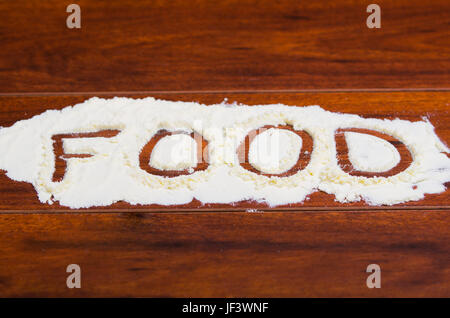 Le mot écrit en alimentaire poudre stevia sur fond de bois. Banque D'Images