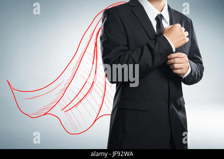 Businessman with appelée cape de couleur rouge. Le concept de la réussite, le leadership et la victoire dans les affaires. Banque D'Images