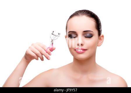 Woman with eyelash curler isolated on white Banque D'Images