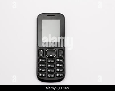 Bouton-poussoir téléphone mobile en noir isolé sur fond blanc. Banque D'Images