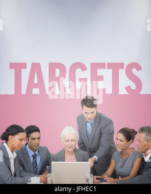 Image composite de business people using laptop Banque D'Images