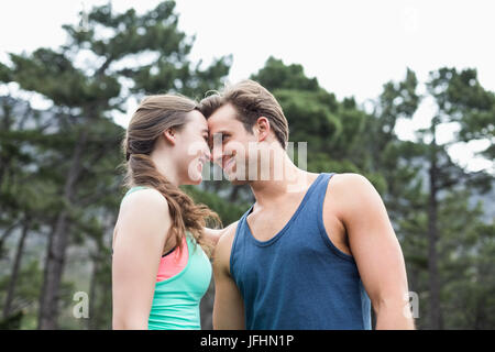 Low angle view of young couple at forest Banque D'Images