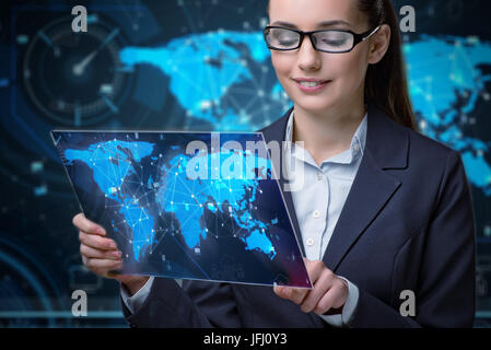 Young businesswoman in global business concept Banque D'Images