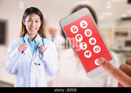 Composite image of doctor holding stethoscope Banque D'Images