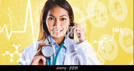 Composite image of doctor holding son stéthoscope Banque D'Images