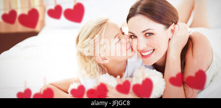 Image composite de cute little girl kissing her mother Banque D'Images