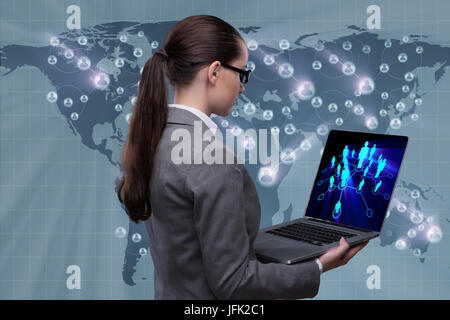 Businesswoman with laptop in social network concept Banque D'Images