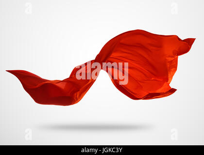 Élégant lisse tissu rouge séparés sur fond gris. La texture de tissu volant. Banque D'Images