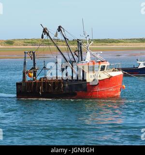 Un dragueur à pétoncles mouillée jusqu'à la rivière Exe Banque D'Images