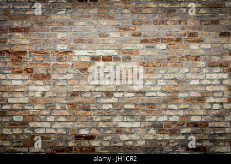 La texture du mur de brique orange vieux grunge background avec vignetted corners Banque D'Images