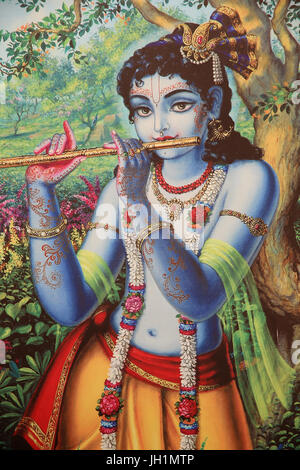 Peinture représentant dieu hindou Krishna jouant de la flûte à l'extérieur. L'Inde. Banque D'Images