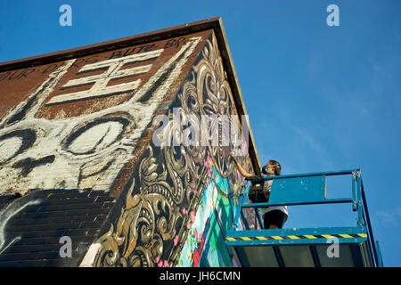 Des artistes de graffiti à l'espace nomade jardins communaux à Shoreditch, Brick Lane. London.UK Banque D'Images