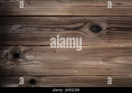 La texture de fond fortement nouée, s'est évanoui et patiné vieux plancher bois. Brown des demi-teintes. Banque D'Images