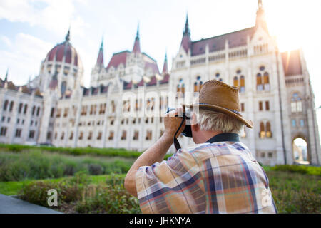 La capture d'pensionné Parlement hongrois en Hongrie, au coucher du soleil Banque D'Images