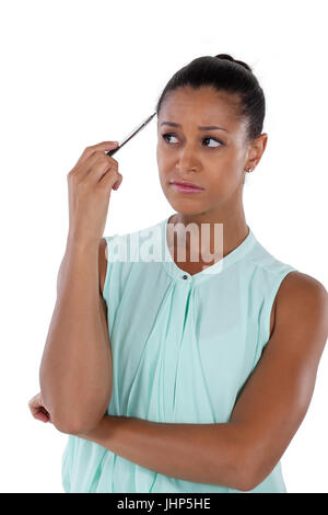Close-up of pensive businesswoman looking sideways Banque D'Images