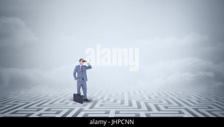 Digital composite of Businessman with briefcase perdu dans le labyrinthe permanent Banque D'Images