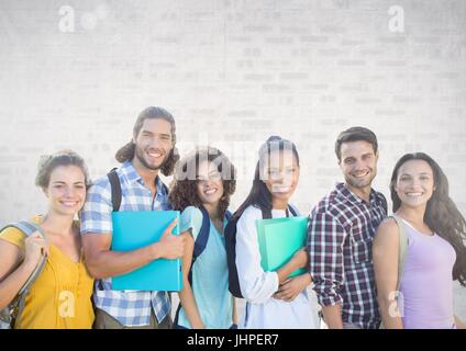 Digital composite de groupe d'étudiants debout devant un arrière-plan gris de brique Banque D'Images