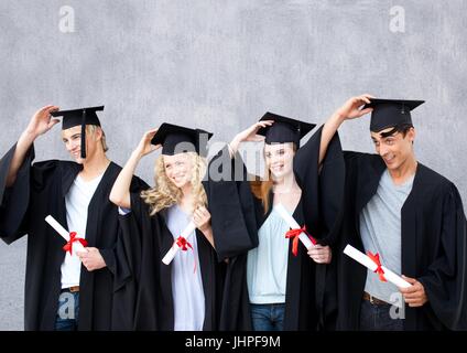 Digital composite de groupe de diplômés, debout devant un fond gris blanc Banque D'Images