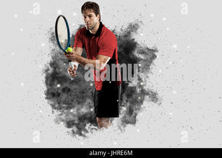 Joueur de tennis avec un uniforme rouge qui sort d'une explosion de fumée . Banque D'Images