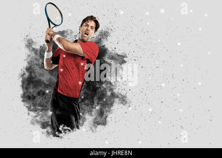 Joueur de tennis avec un uniforme rouge qui sort d'une explosion de fumée . Banque D'Images