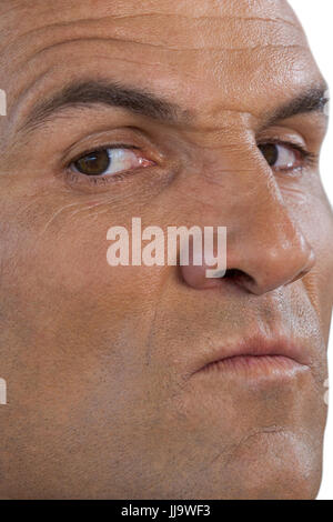 Close up portrait of serious man against white background Banque D'Images
