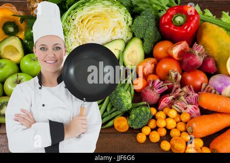 Digital composite du chef contre l'arrière-plan de légumes Banque D'Images