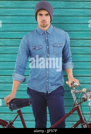 Digital composite de hipster avec vélo en face de light blue background Banque D'Images