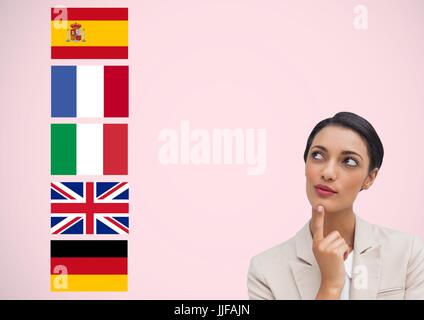 Langue principale de drapeaux près de young businesswoman. Fond rose Banque D'Images