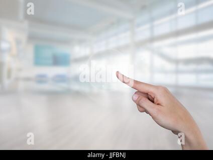 Digital composite of Hand touching bright gym sports hall background Banque D'Images