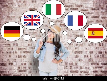 Digital composite de jeune femme heureuse pensant dans les principales langues. Mur de briques Banque D'Images