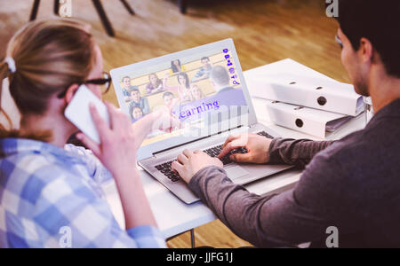 Image composite de cours en ligne contre vue arrière des cadres travaillant au bureau de création Banque D'Images