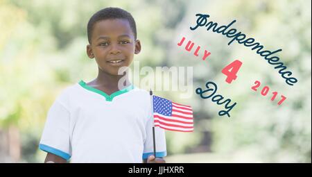 Quatrième de juillet graphique à côté boy holding american flag Banque D'Images