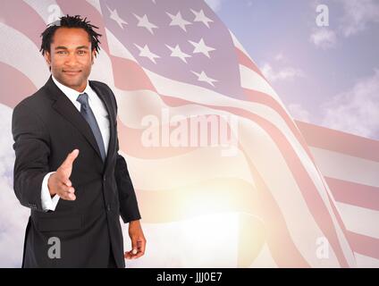 L'homme d'affaires secouant sa main contre drapeau américain Banque D'Images