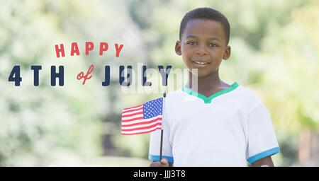 Quatrième de juillet graphique à côté boy holding american flag Banque D'Images