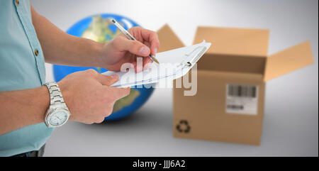 Image 3D composite de delivery man writing on clipboard Banque D'Images