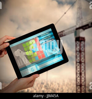 Image 3D composite de hands holding digital tablet against white background Banque D'Images