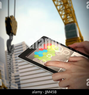 Image 3D composite de close-up of woman holding digital tablet Banque D'Images