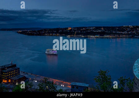 Quebec City, Canada - May 30, 2017: Cityscape or skyline aerial view of Saint Lawrence river and Levis with illuminated ferry at night Banque D'Images